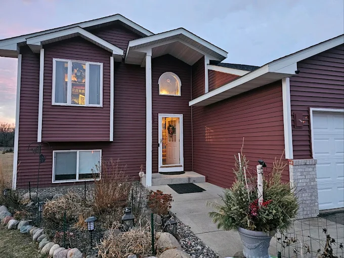 Burgundy vinyl siding replacement project