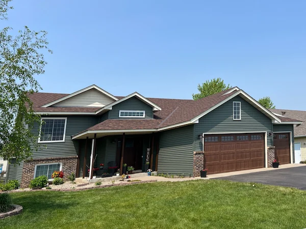 Green vinyl siding replacement project