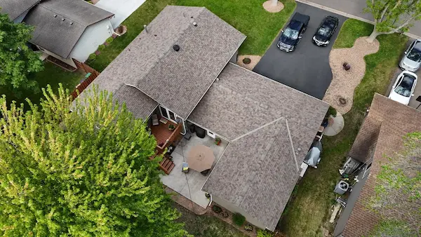Full exterior renovation with Hardie siding, Versetta Stone, new roofing, windows, doors, soffit, fascia, and gutters in Champlin, MN