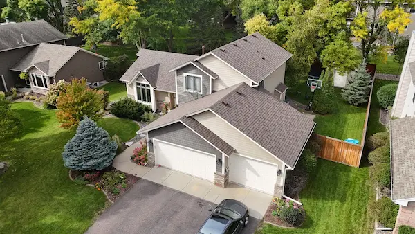 Aerial view of completed Owens Corning asphalt shingle roof replacement on a home in Maple Grove, MN