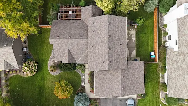 Top-down aerial view of Owens Corning asphalt shingles covering a multi-section roof in Maple Grove, MN