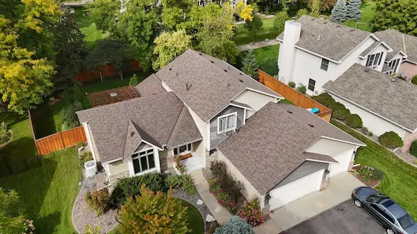 Completed Owens Corning asphalt shingle roof replacement on a two-story home in Maple Grove, MN