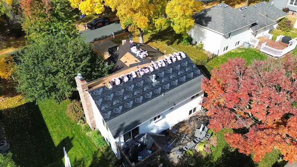 Overhead drone view of an Owens Corning asphalt shingle roofing project in Maple Grove, Minnesota