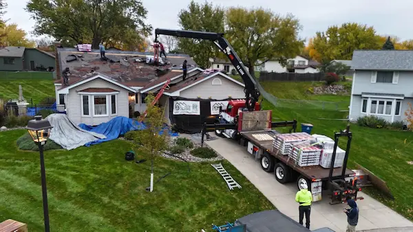 Drone view of a residential Owens Corning asphalt roof replacement project in Maple Grove, MN