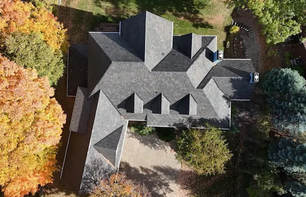 Overhead aerial view of completed Brava slate-style composite roof replacement on a home in Mound, MN
