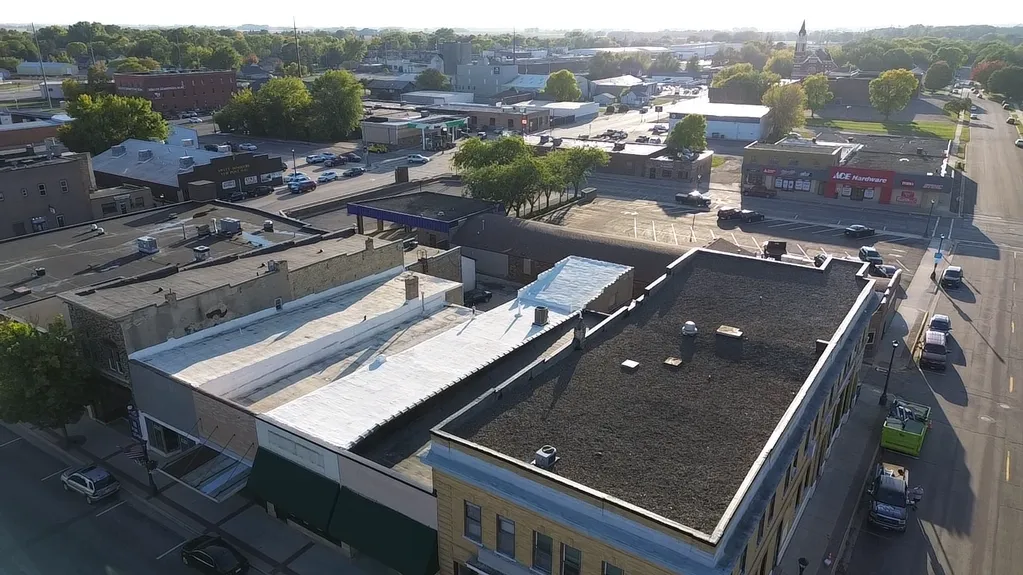 commercial flat EPDM rubber roof replacement project for a downtown building