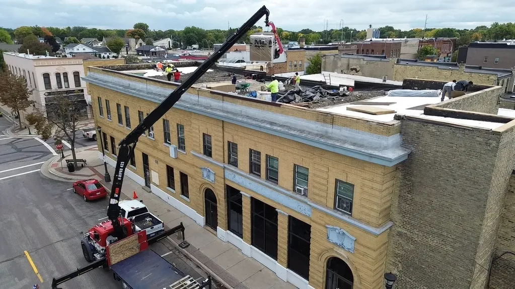 flat EPDM rubber roof replacement project for a downtown Minnesota building