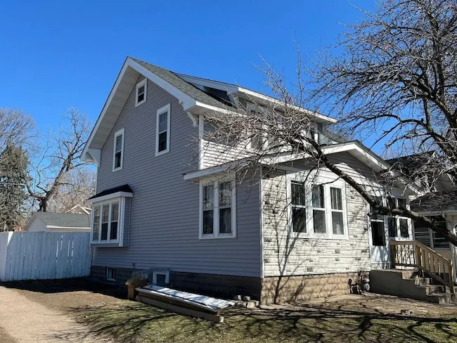 After storm damage restoration with replaced siding and roof